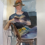 Marcella-reading-wearing-hat